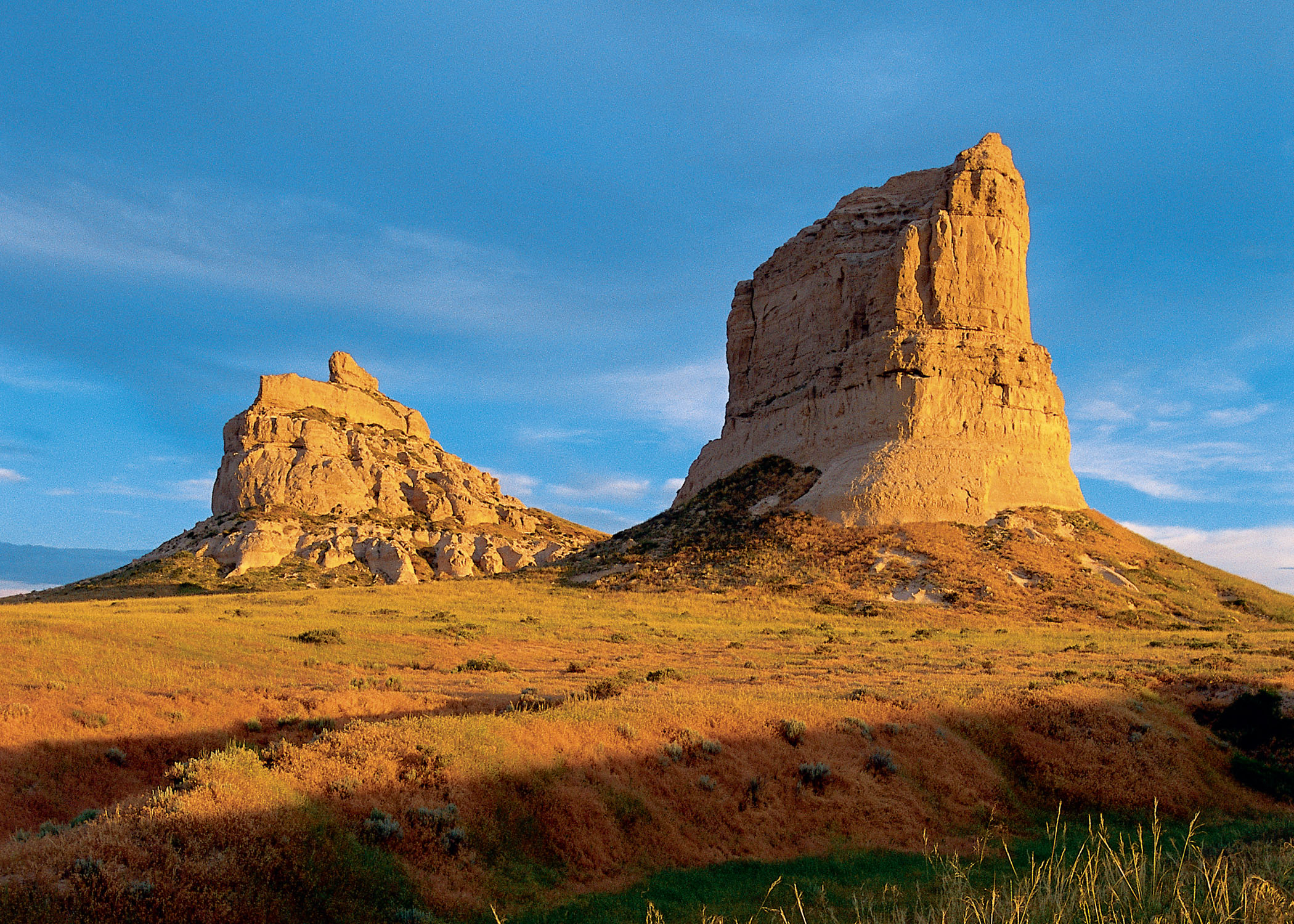 Courthouse and Jail Rocks towering beneath a blue sky.