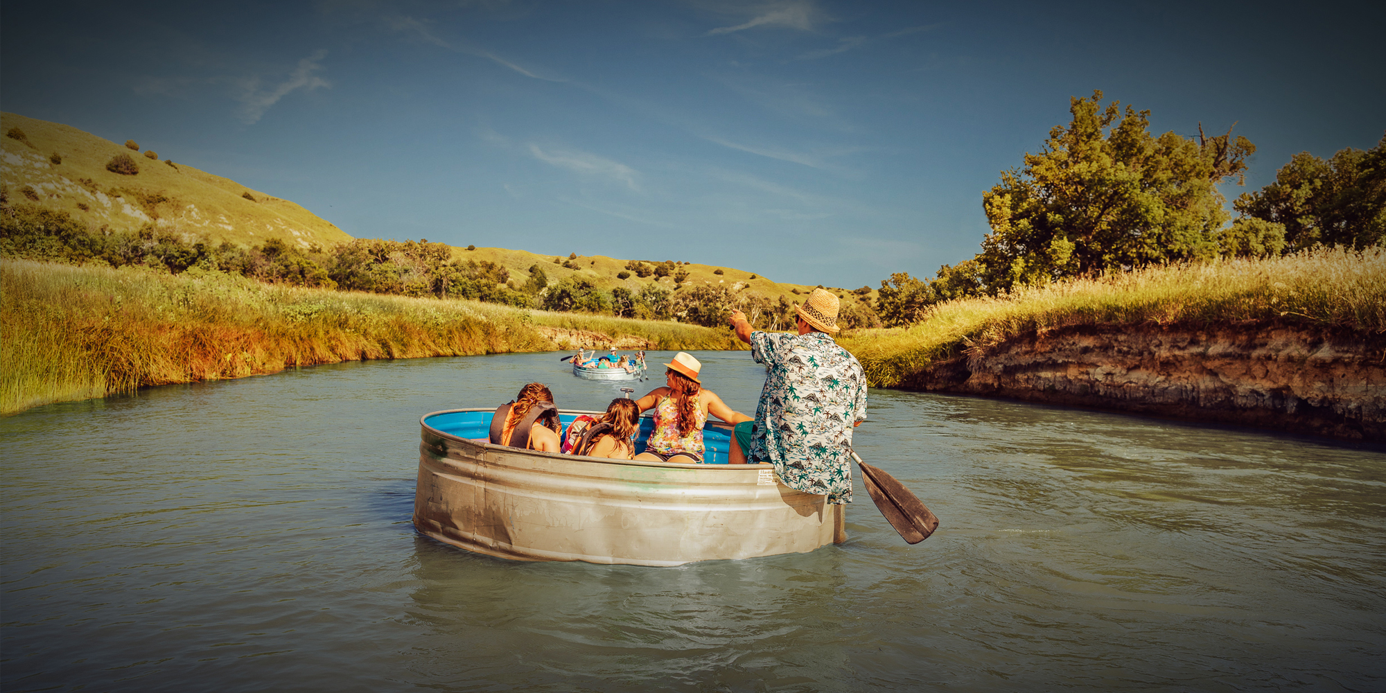 A family enjoys tanking in giant metal drums on a river near Mullen, Nebraska.