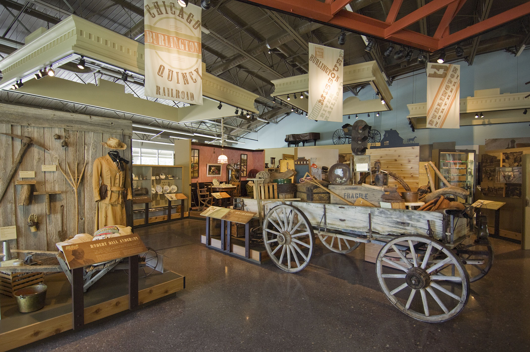 A wagon and pioneer and frontier artifacts on display at the Knight Museum and Sandhills Center.