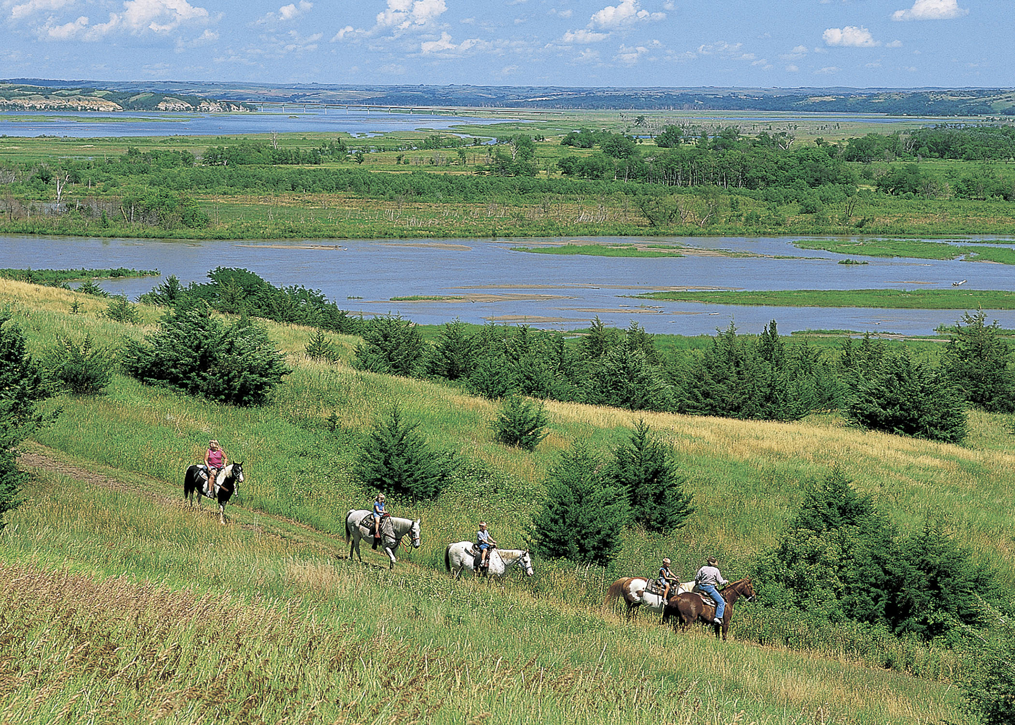 Five people riding horseback at Niobrara State Park.