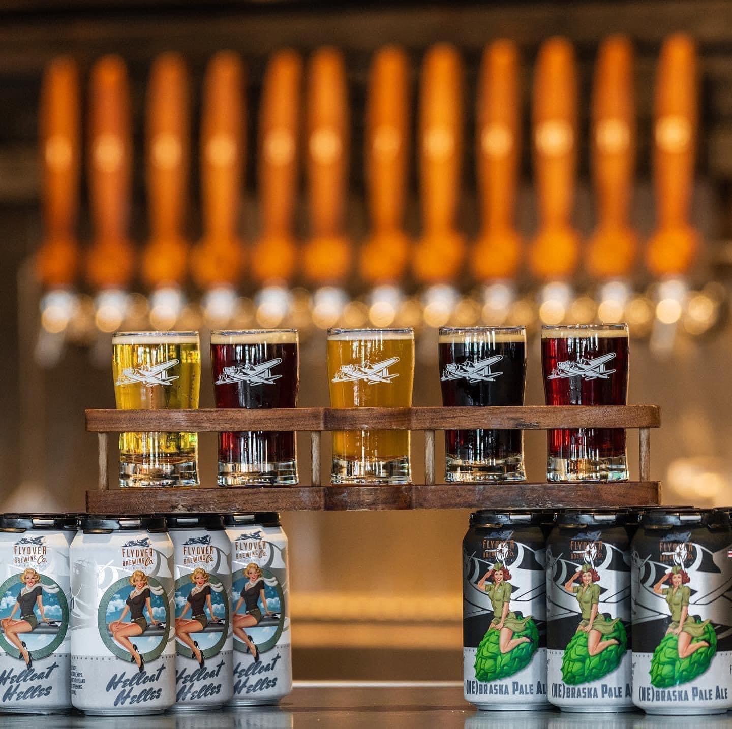 Pint flight and beer products on display.