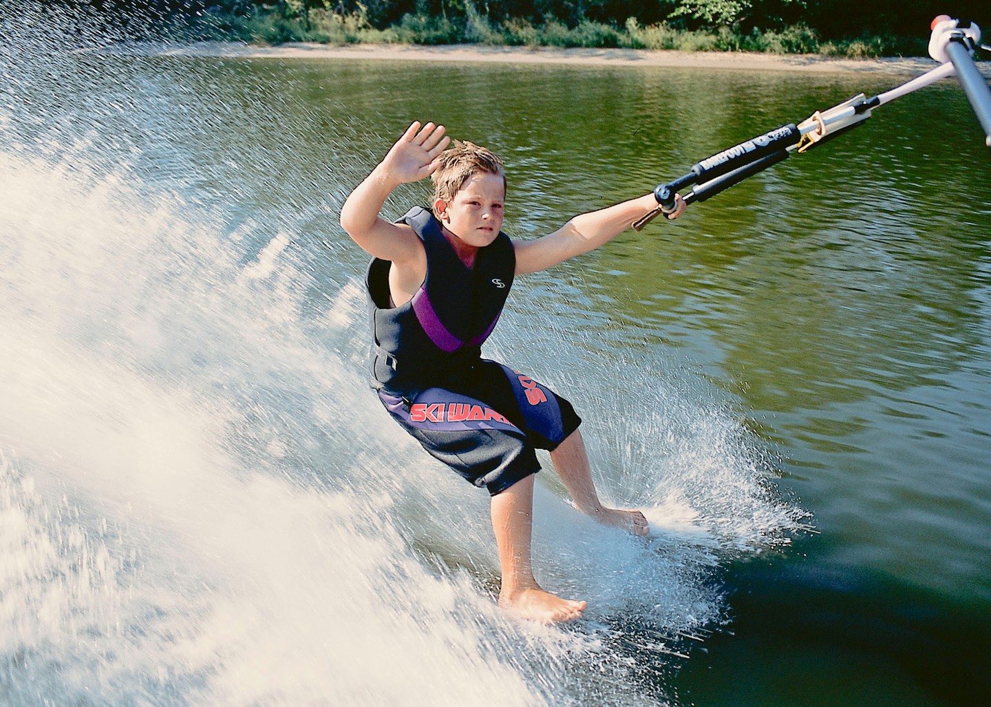 A boy waterskiing at Fremont Lakes State Recreation Area.