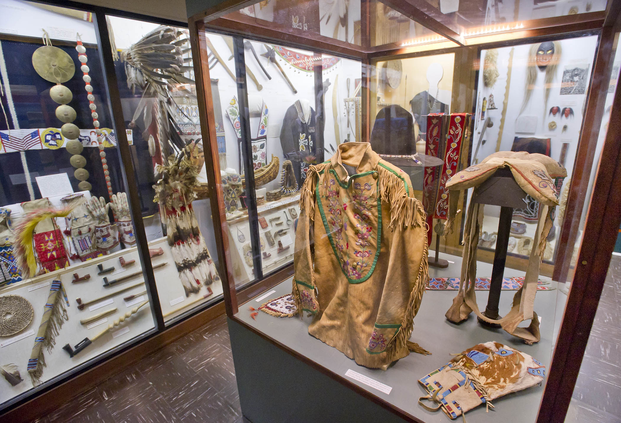 Native American clothing and other artifacts on display at Museum of the Fur Trade.