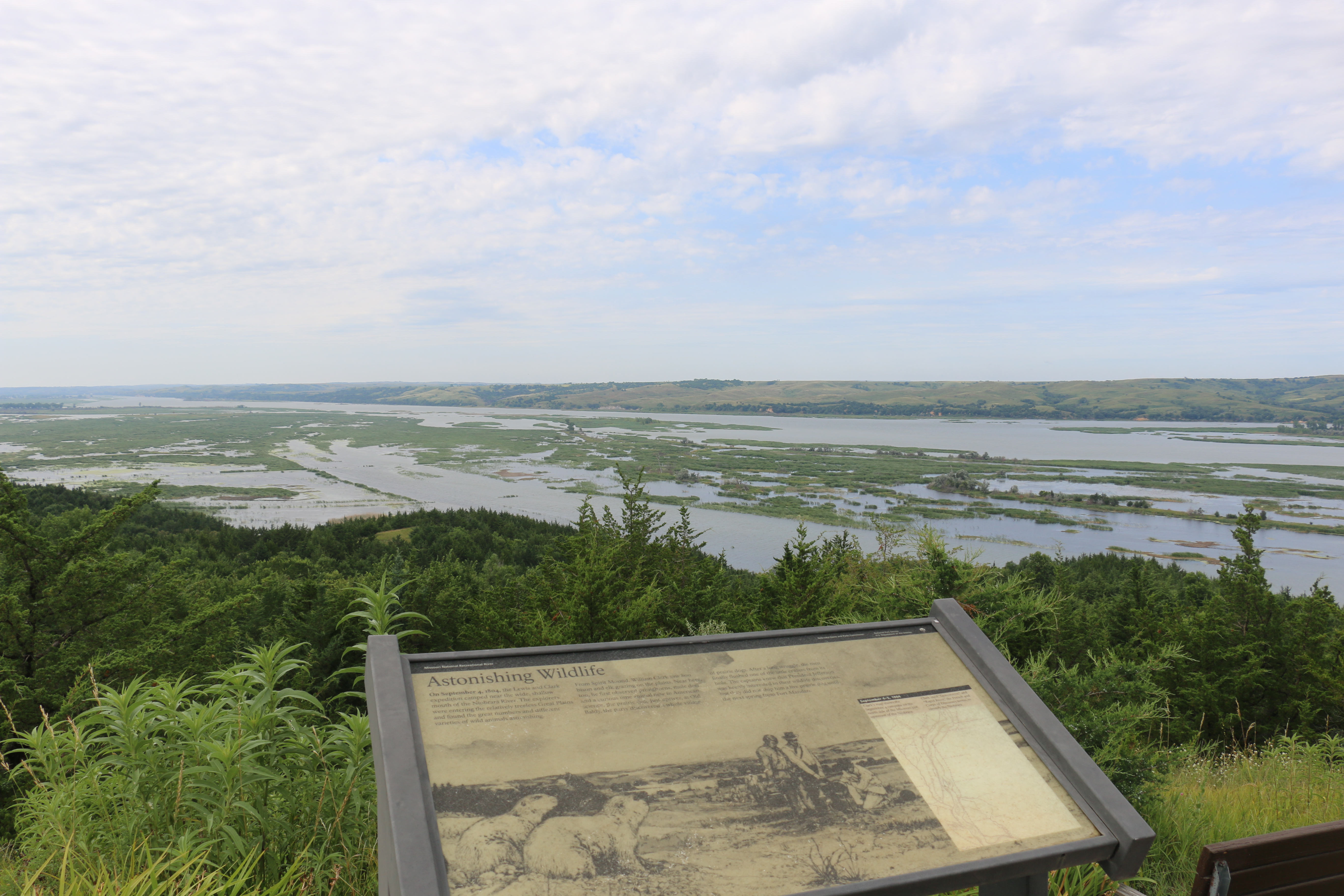 A view from a historical display with bodies of water in the background at Niobrara State Park.