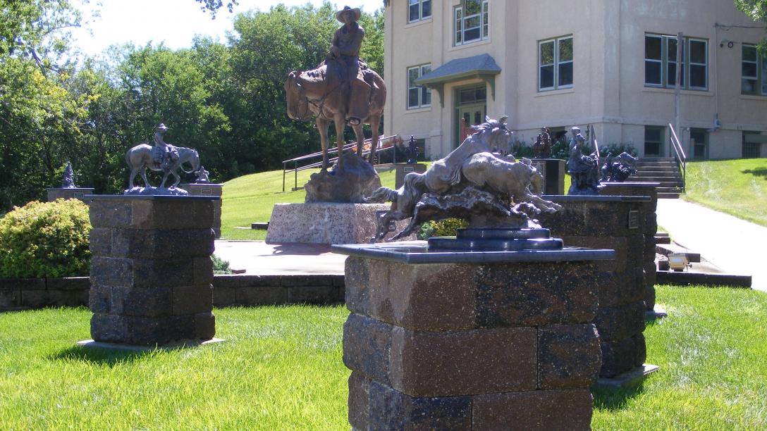 A collection of sculptures at Mignery Sculpture Garden in Bartlett