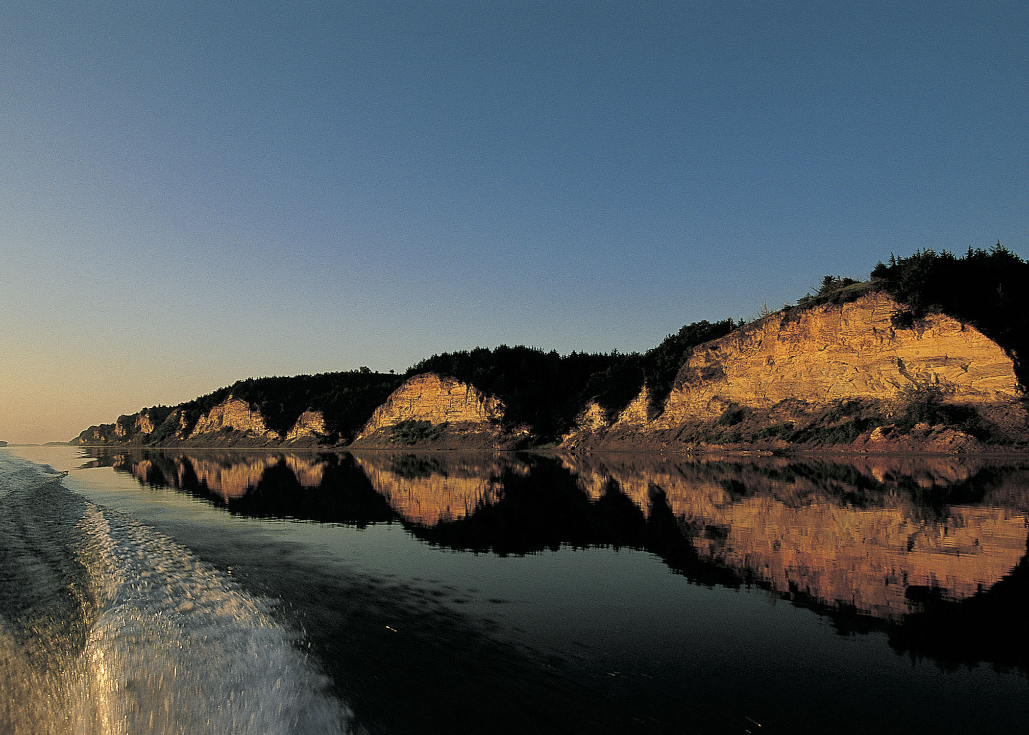 a view of cliffs rising from the water at Niobrara State Park.