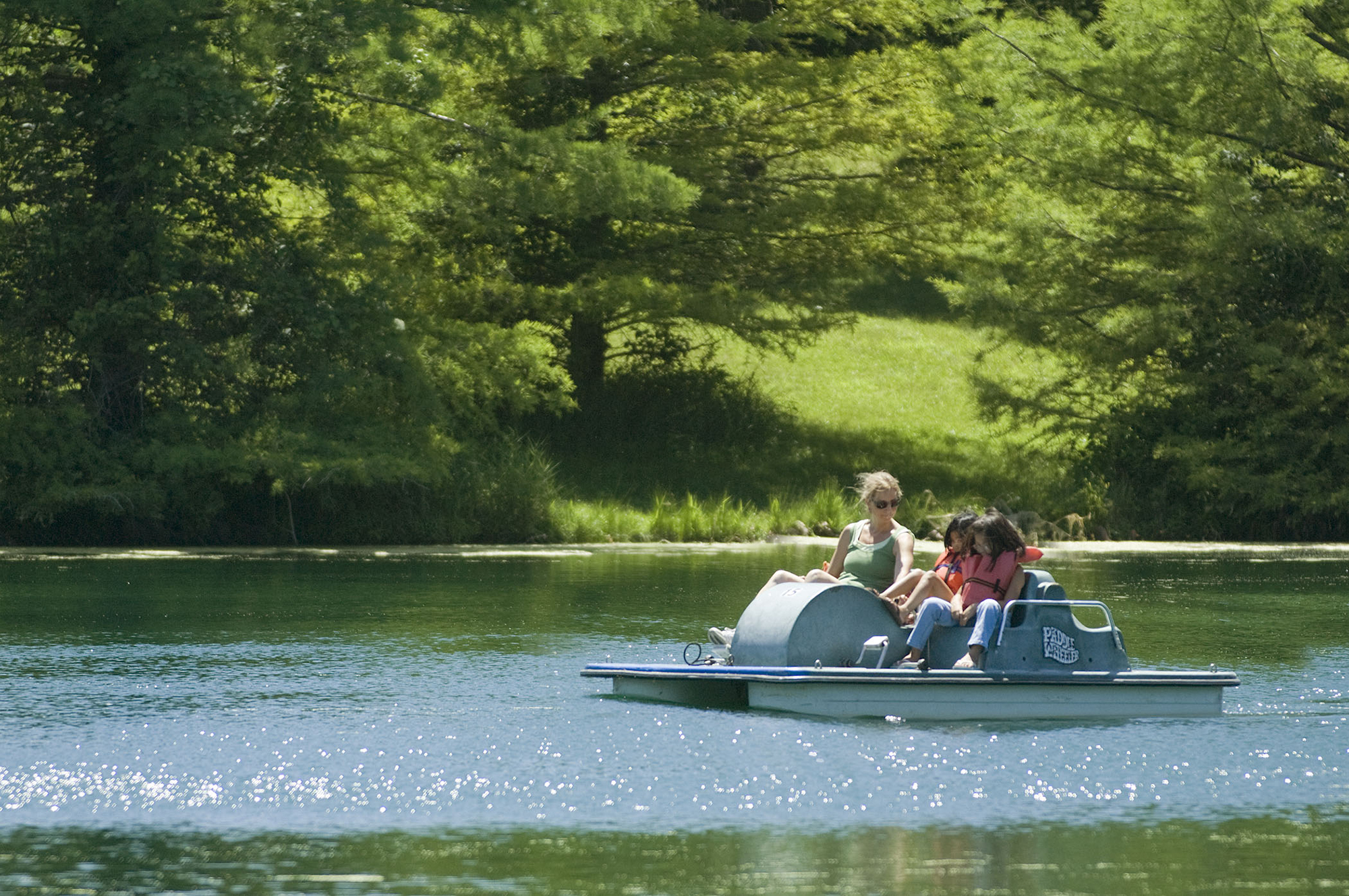 Three pedal boaters on the water at Platter River State Park.