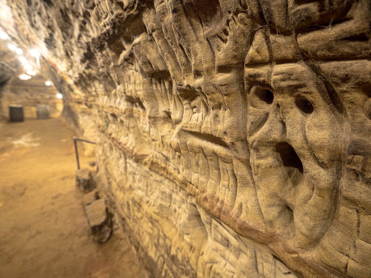 Carving that looks like a face on the wall inside Robber's Cave.