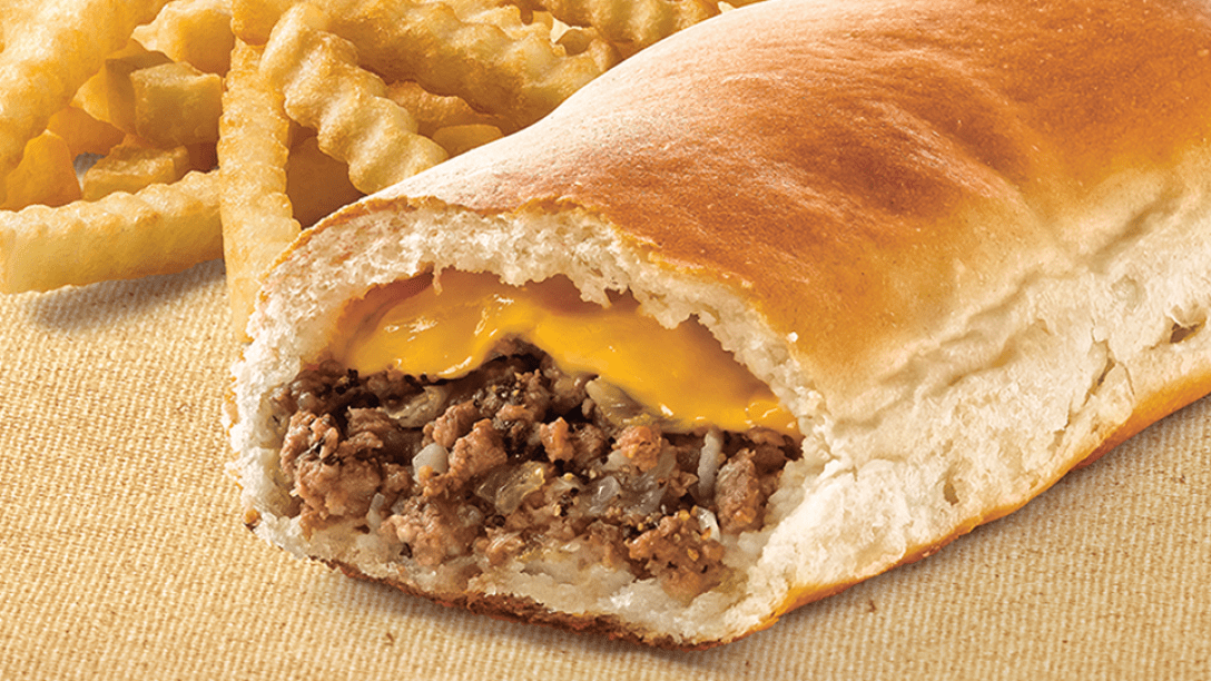 A Runza sandwich filled with cheese and fries on the side.
