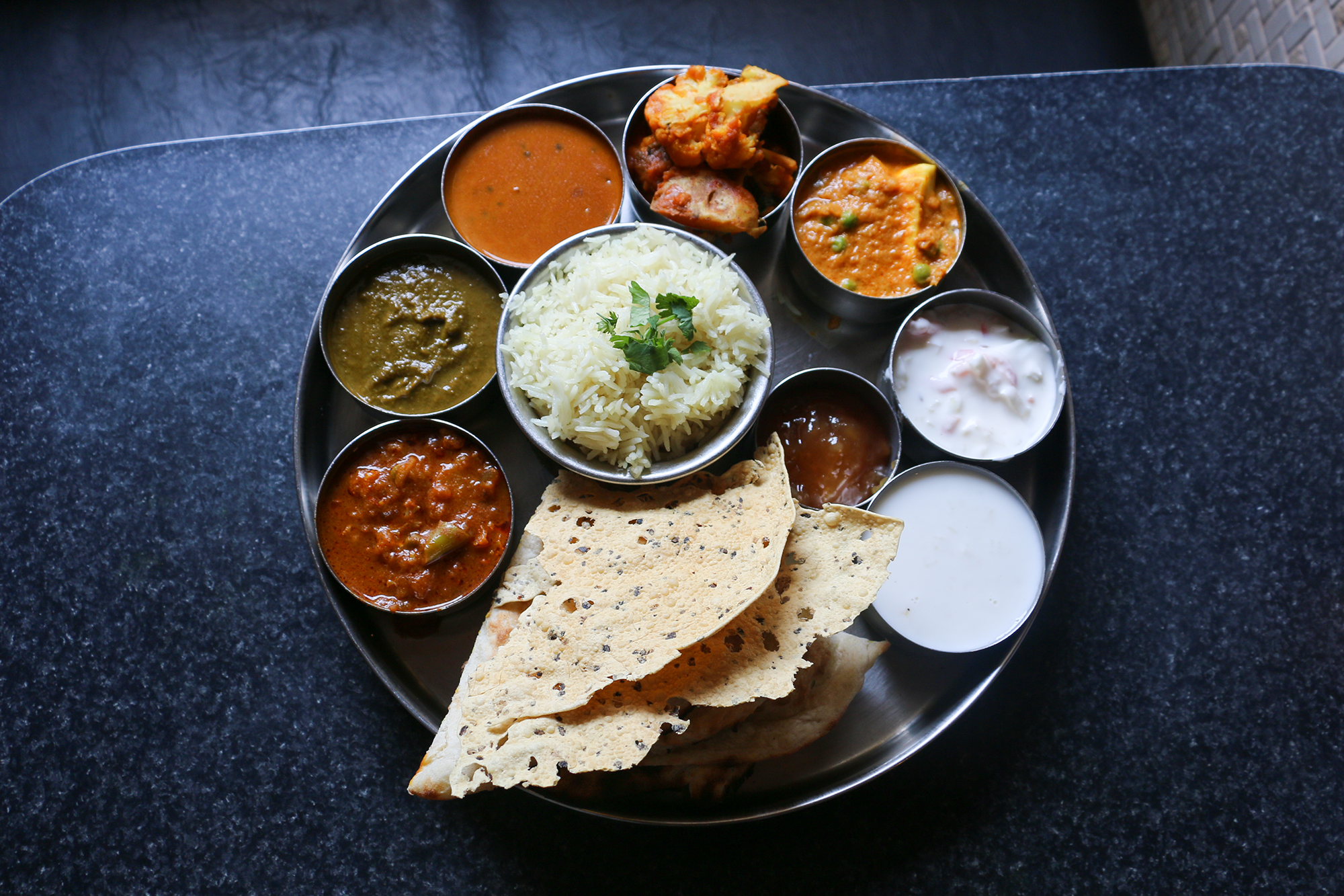 A colorful plate of vegetarian thali at The Oven in Lincoln. 