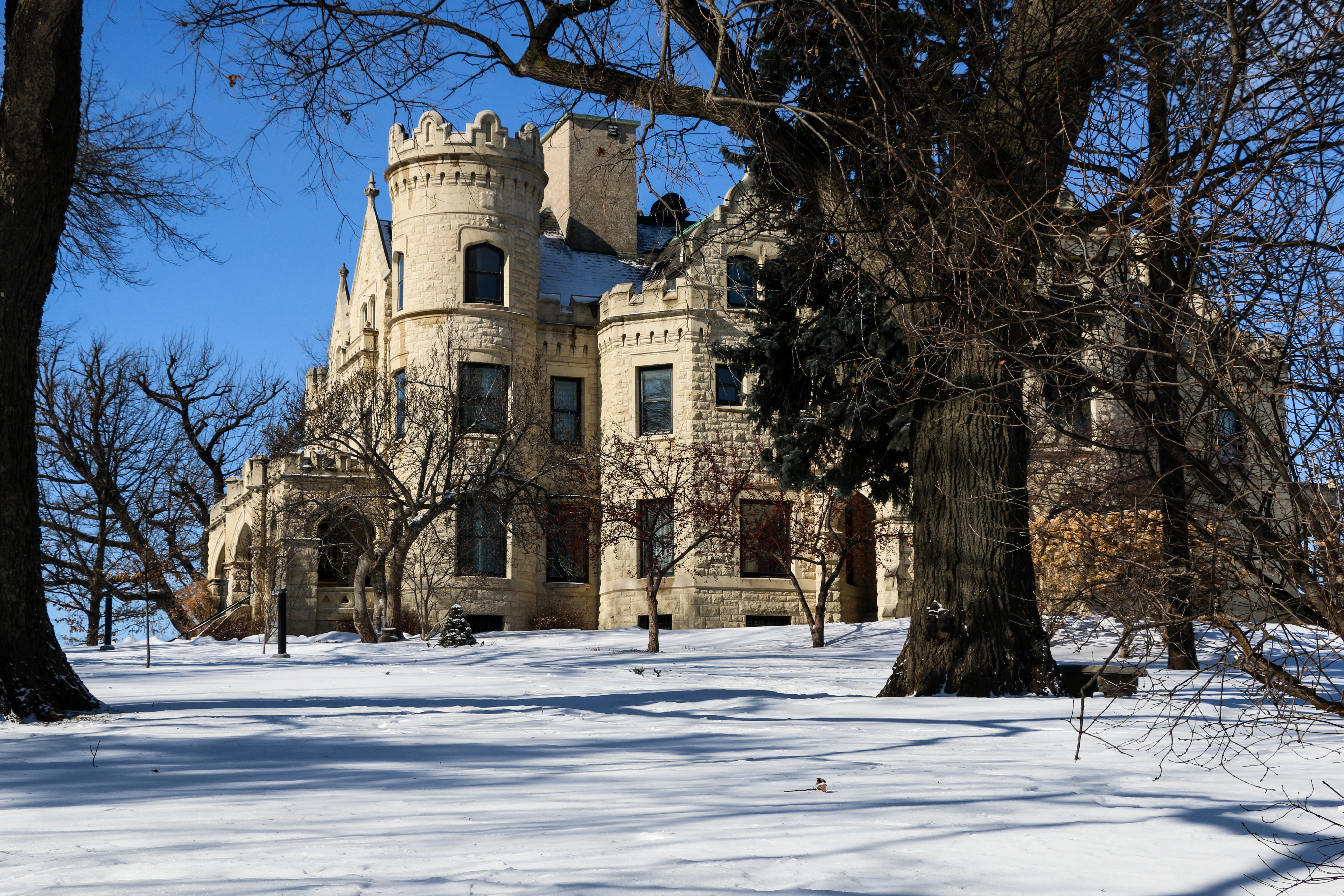 The exterior of Omaha, Nebraska's Joslyn Castle & Gardens after snow has fallen.